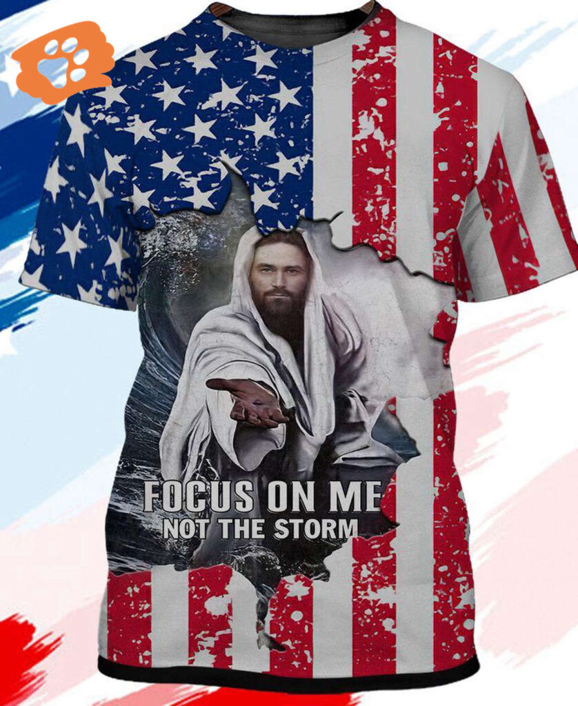 Jesus T-shirt Focus On Me Not The Storm Offering His Hand American Flag Shirt Jesus Apparel 2025 Jesus T-shirt Focus On Me Not The Storm Offering His Hand American Flag Shirt Jesus Apparel 2025